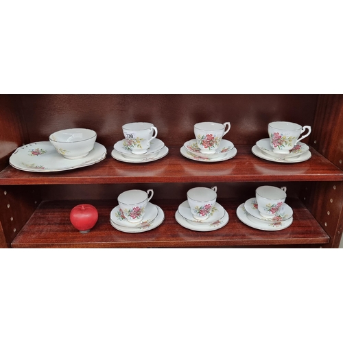 A twenty-piece tea set comprising of a sandwich plate, sugar bowl, teacups, side plates and saucers. Featuring a pretty floral design and gilt accents. All in good condition.