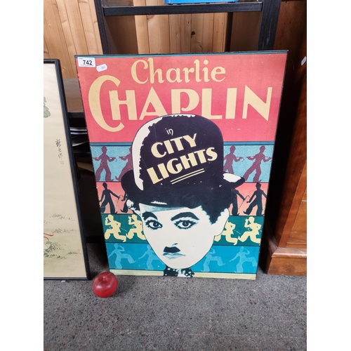 742 - A large wall hanging advertising the Charlie Chaplin film titled 'City Lights'.