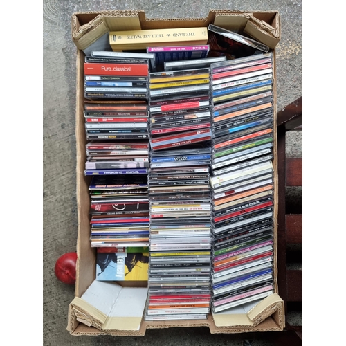 753 - A box containing a large collection of approx. 100 CDs including artists Bob Dylan, Abba, Tom Jones ... 