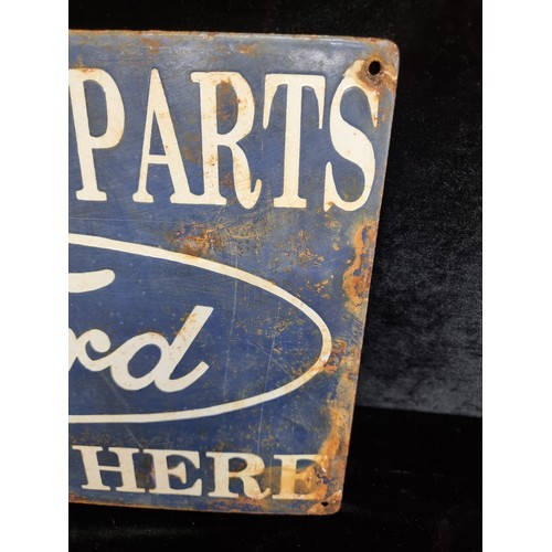 182 - A heavy vintage and hand painted enameled metal wall sign advertising Ford reading 