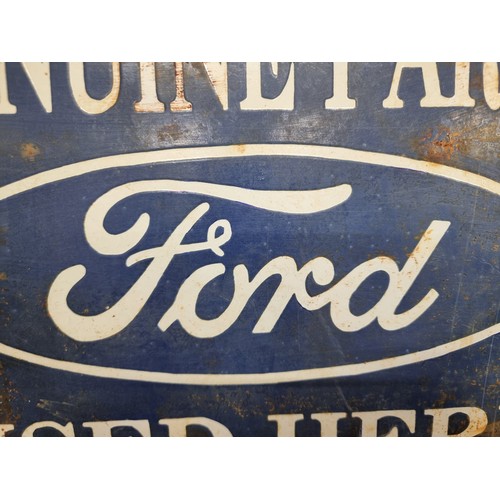 182 - A heavy vintage and hand painted enameled metal wall sign advertising Ford reading 