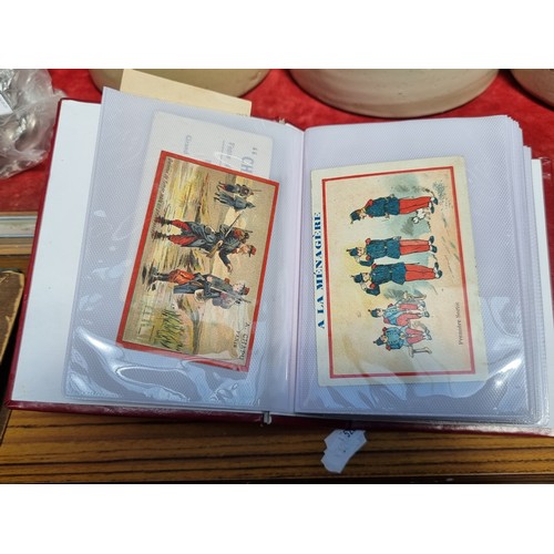 362 - An album containing 100 collectible antique and vintage advertisement cards all in French. Advertisi... 