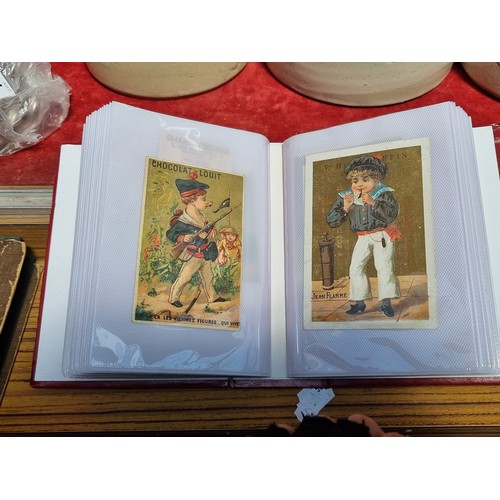 362 - An album containing 100 collectible antique and vintage advertisement cards all in French. Advertisi... 