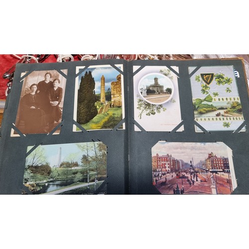 363 - A vintage postcard album containing 90 postcards including examples showing popular tourist destinat... 