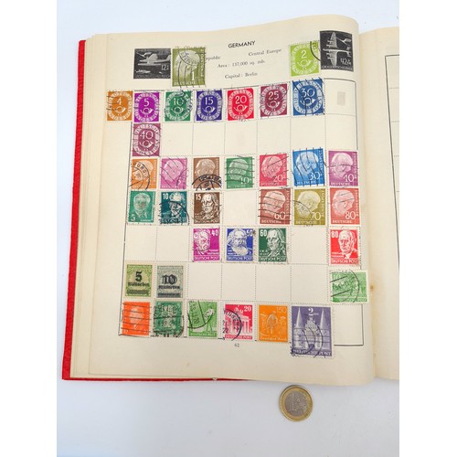 96 - A good vintage stamp album holding a wide variety of global stamps including a particularly rich col... 