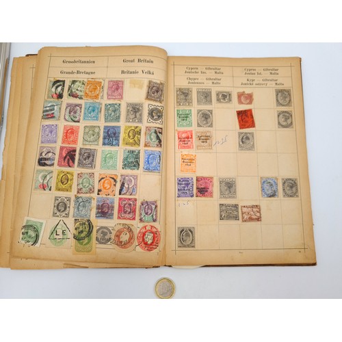 97 - A very good vintage stamp album holding a wide variety of global stamps including English examples s... 