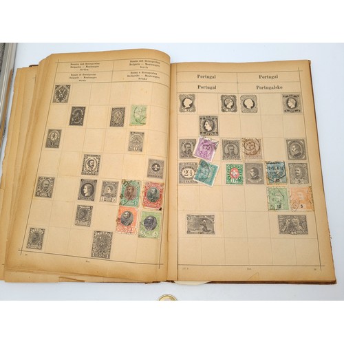 97 - A very good vintage stamp album holding a wide variety of global stamps including English examples s... 