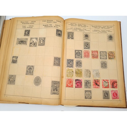 97 - A very good vintage stamp album holding a wide variety of global stamps including English examples s... 