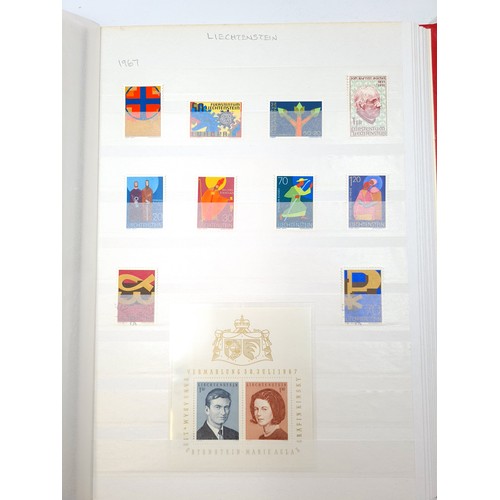 149 - A stamp album containing 714 Austrian stamps dating from between 1871-1988 along with 71 Lichtenstei... 