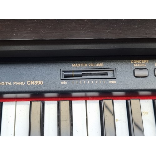 634 - Star lot : A Kawai digital piano model no. CN390 with full sized weighted keyboard, wooden frame, th... 