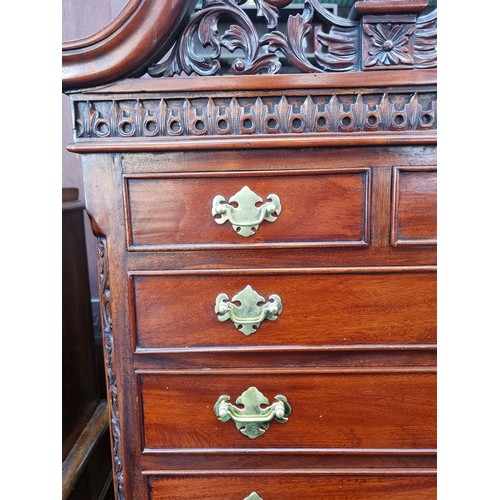 659 - Star lot : A highly ornate chest of drawers with nine drawers in total, each boasting attractive bra... 