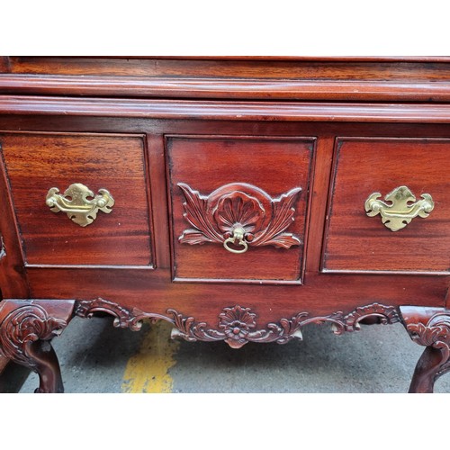 659 - Star lot : A highly ornate chest of drawers with nine drawers in total, each boasting attractive bra... 