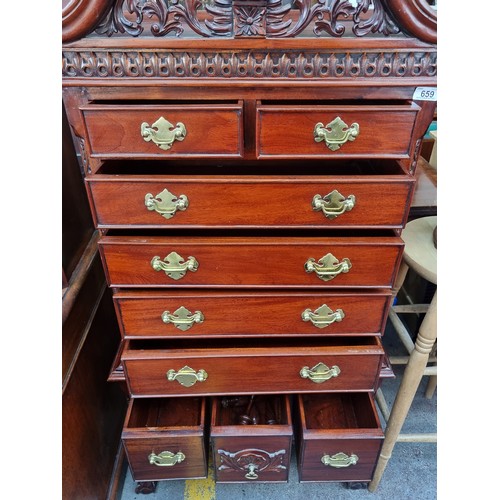 659 - Star lot : A highly ornate chest of drawers with nine drawers in total, each boasting attractive bra... 