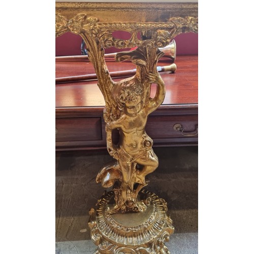 661 - Star Lot : A striking Baroque style console table with highly ornate gilt stem consisting of a cheru... 