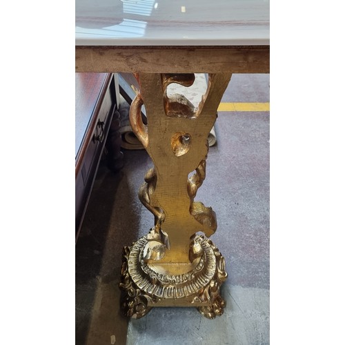 661 - Star Lot : A striking Baroque style console table with highly ornate gilt stem consisting of a cheru... 