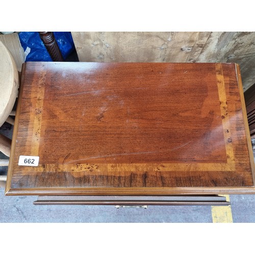 662 - A lovely golden mahogany side table with single drawer to front boasting brass drop handle. Held on ... 