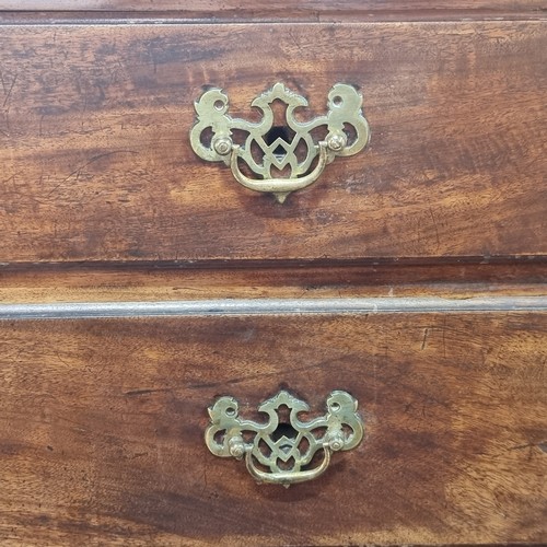 712 - Star Lot : A fabulous Georgian golden mahogany  chest of drawers with four drawers to front boasting... 