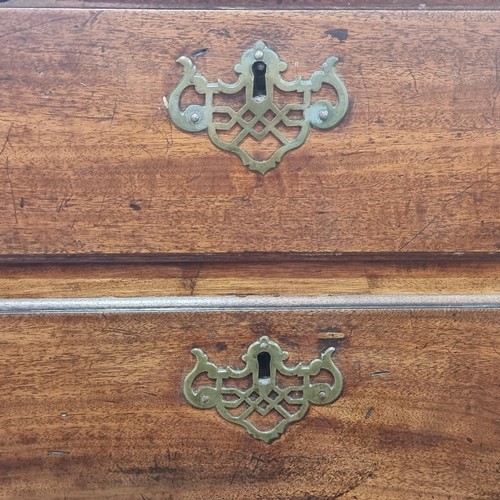 712 - Star Lot : A fabulous Georgian golden mahogany  chest of drawers with four drawers to front boasting... 