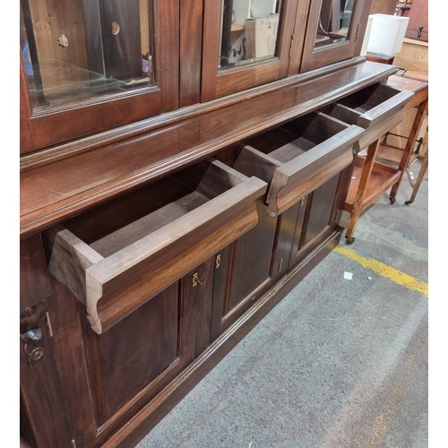 713 - Star lot : A large and impressive Mahogany triple dresser with three glass fronted display cabinets ... 