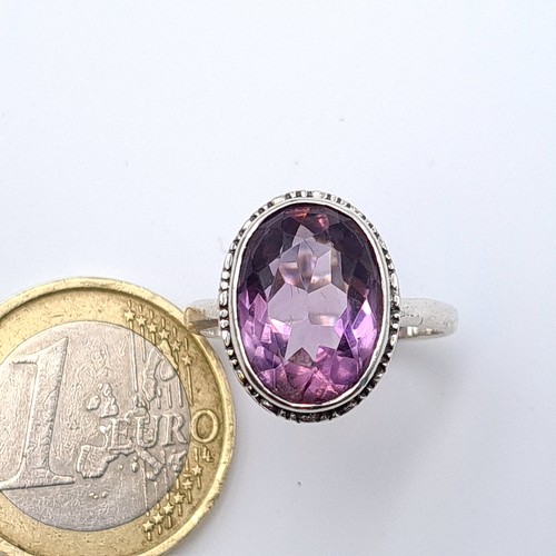 5 - A beautiful and generous sterling silver facet cut Amethyst oval stone ring. Ring size: M. Weight: 4... 