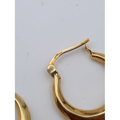33 - A fabulous pair of 9 carat gold hooped earrings, with a weight of 1 gram. Stamped 375.