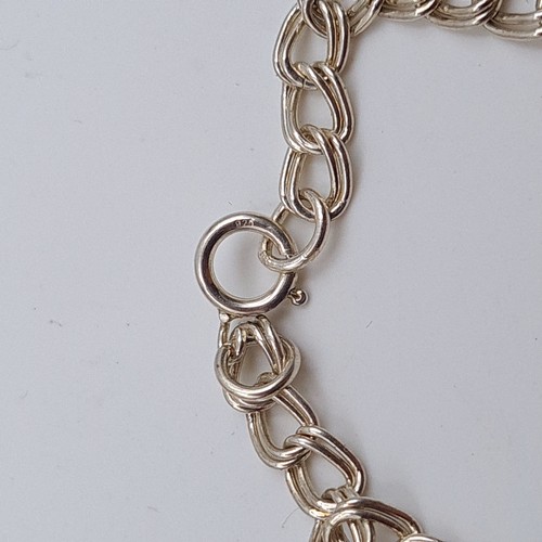 35 - A collection of three sterling silver items, consisting of two sterling silver chain link bracelets.... 