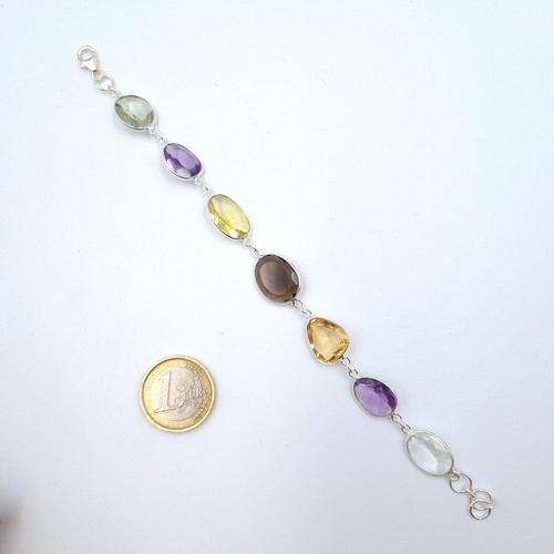51 - A beautiful Citrine and Amethyst sterling silver bracelet, set with a lobster clasp and stamped 925.... 
