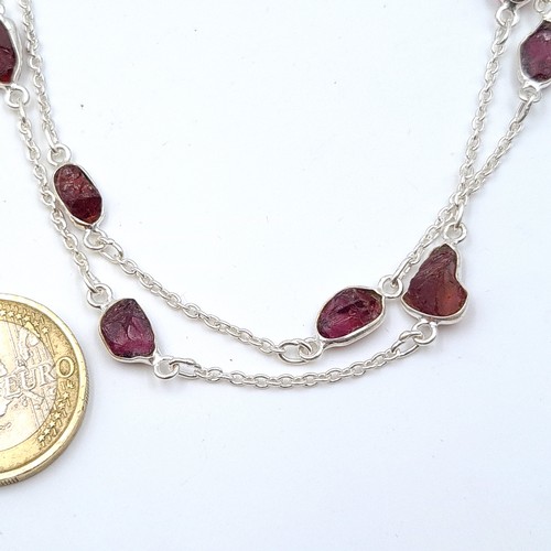 53 - An unusual sterling silver set Tourmaline rough cut natural stone necklace. Length of necklace: 72cm... 