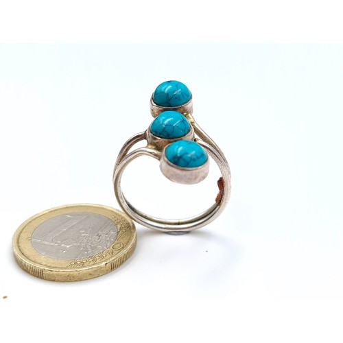 575 - A stunning three stone Turquoise sterling silver ring. Ring size: R. Weight: 3.65 grams.