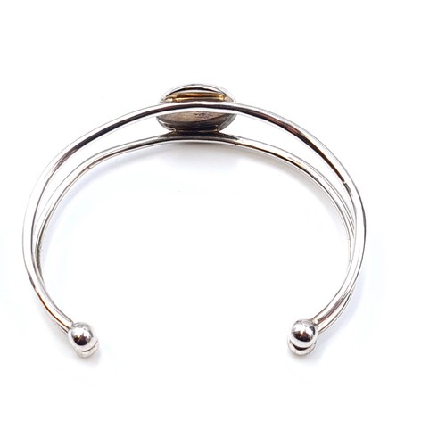 577 - A pretty sterling silver contemporary Irish designed bangle, by the 