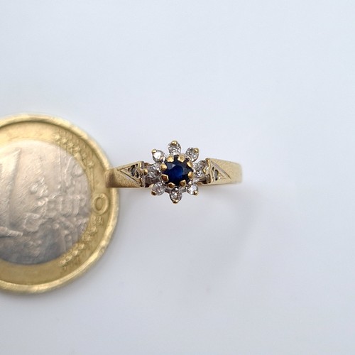 579 - Star lot : A beautiful vintage 9 carat gold Sapphire and Diamond ring, set beautifully with a centra... 