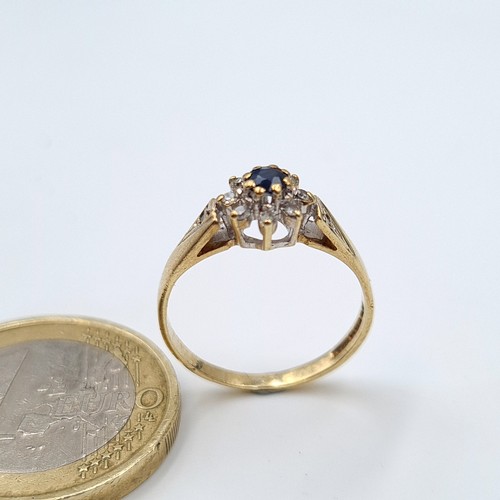 579 - Star lot : A beautiful vintage 9 carat gold Sapphire and Diamond ring, set beautifully with a centra... 