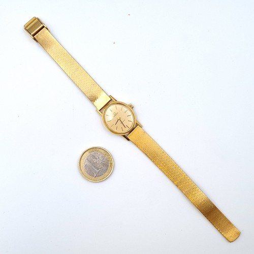 584 - Star Lot : An exceptional vintage genuine Gold 750 Omega ladies wrist watch, set with a beautiful go... 