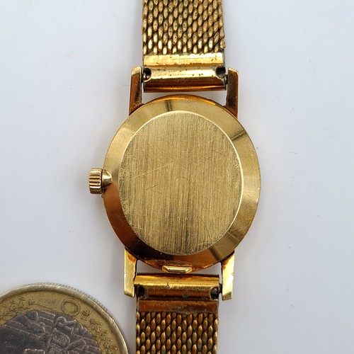 584 - Star Lot : An exceptional vintage genuine Gold 750 Omega ladies wrist watch, set with a beautiful go... 