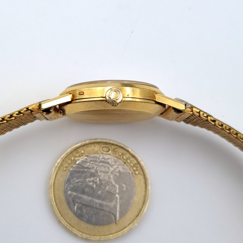 584 - Star Lot : An exceptional vintage genuine Gold 750 Omega ladies wrist watch, set with a beautiful go... 