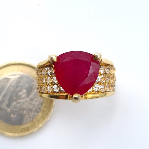 601 - Star Lot: An exceptional Ruby and Diamond silver gilt cocktail ring, featuring a generous central Ru... 