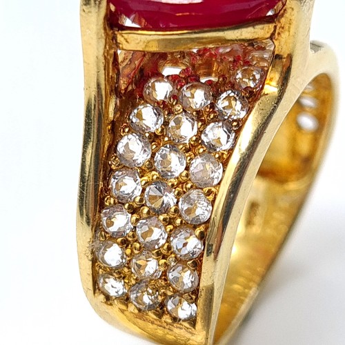 601 - Star Lot: An exceptional Ruby and Diamond silver gilt cocktail ring, featuring a generous central Ru... 