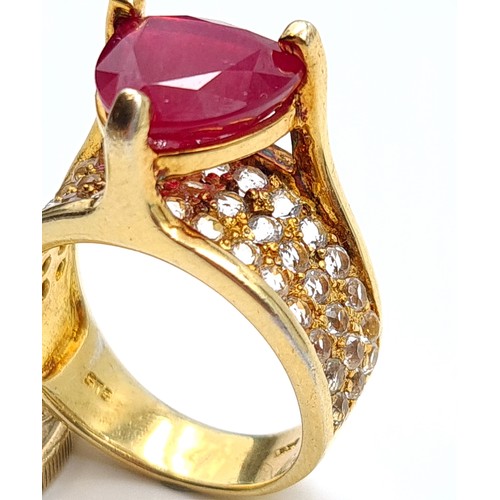 601 - Star Lot: An exceptional Ruby and Diamond silver gilt cocktail ring, featuring a generous central Ru... 