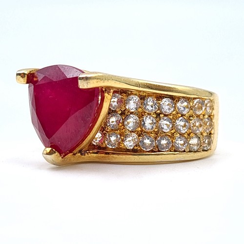 601 - Star Lot: An exceptional Ruby and Diamond silver gilt cocktail ring, featuring a generous central Ru... 