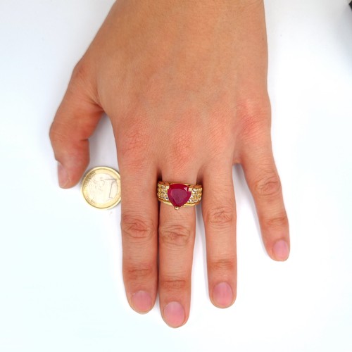 601 - Star Lot: An exceptional Ruby and Diamond silver gilt cocktail ring, featuring a generous central Ru... 