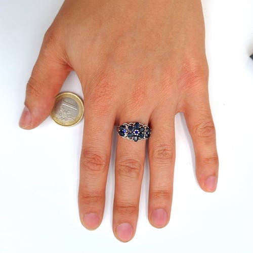 602 - A jaw dropping Sapphire multi stone ring, set with Marcasite detail and forming a fabulous floral mo... 