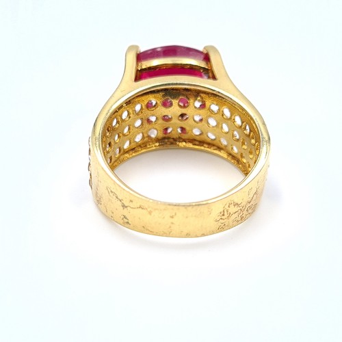 601 - Star Lot: An exceptional Ruby and Diamond silver gilt cocktail ring, featuring a generous central Ru... 