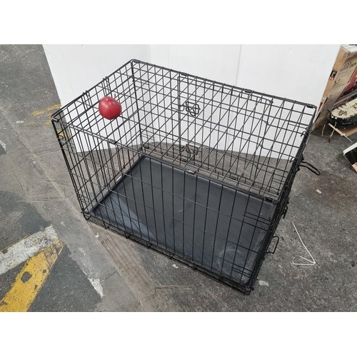 435 - A large folding dog crate with base measurement of L115cm x W72cm. In very good condition.