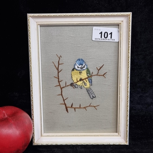 101 - A very charming and characterful embroidery piece in the form of a blue tit daintily perched on a th... 