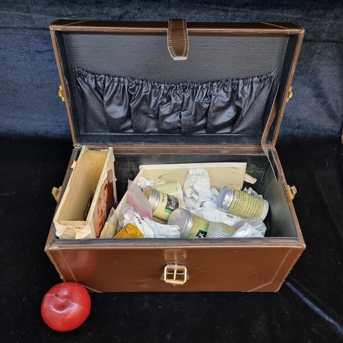 130 - A vintage leather carry case filled with a large amount of unchecked vintage coins, largely pre-deci... 