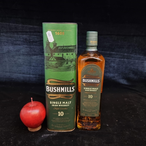 132 - A sealed 70cl bottle of Bushmills Single Malt Irish Whiskey, aged 10 years, in original presentation... 