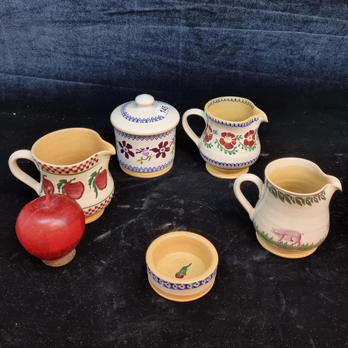 145 - Five pieces of Micholas Mosse pottery including three creamers, sauce dish and sugar bowl. All in ch... 