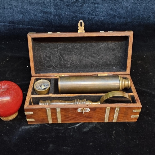 156 - A charming ship captain's nautical desk set. Comprising of a compass, magnifying glass and a spyglas... 