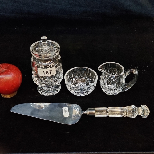 187 - A selection of four Waterford Crystal items. Including a cake slice a conserve jar and a bachelor cr... 