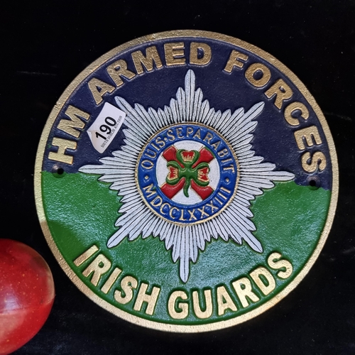 190 - A heavy cast metal circular plaque for ''H.M ARMED FORCES IRISH GUARDS''. Handpainted with gilt text... 